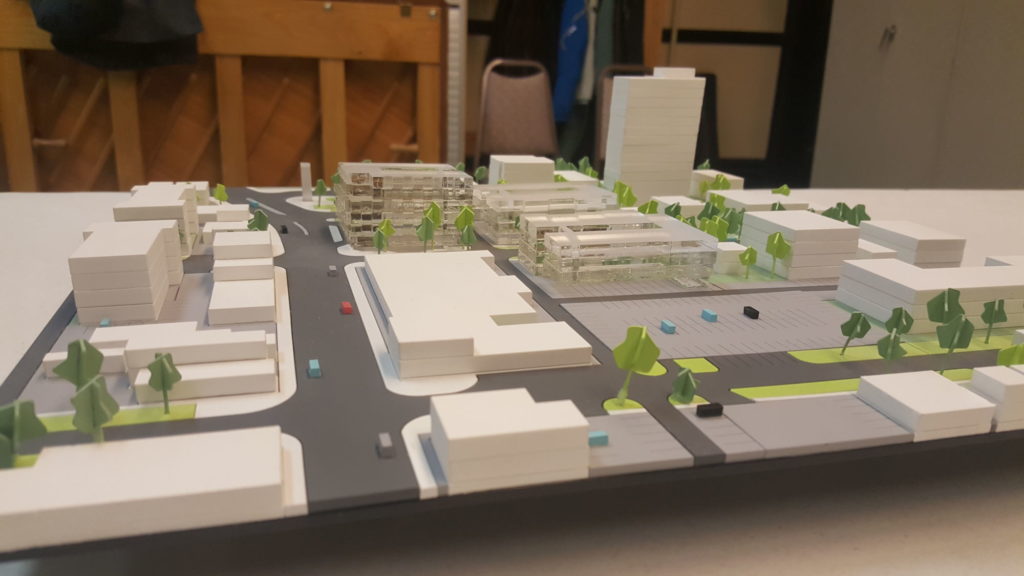 Model shows the massing of three new developments (clear blocks) proposed for the site of the former Osborne Village Inn.